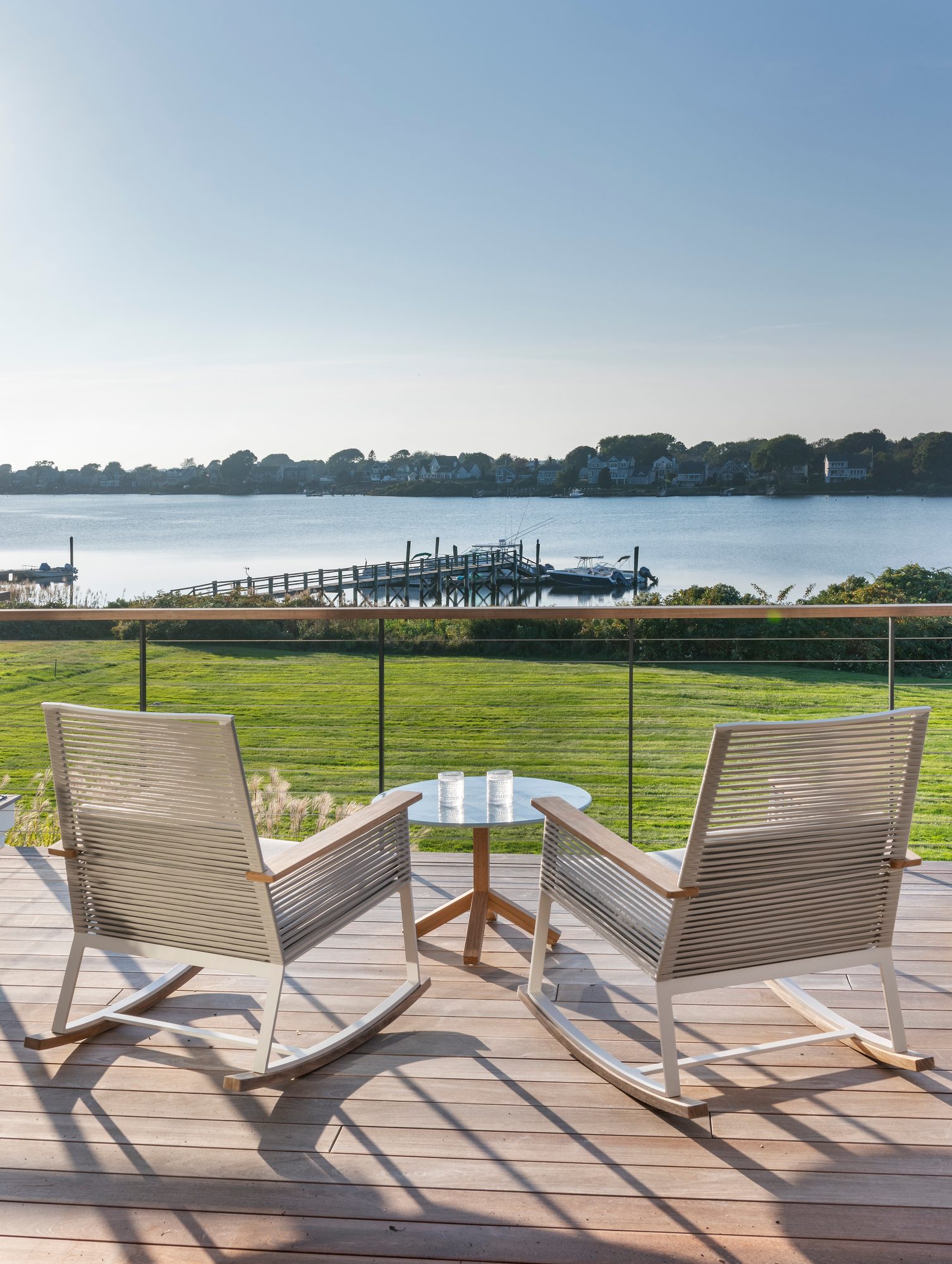 Rhode Island Residence — rope rocking chairs facing the water