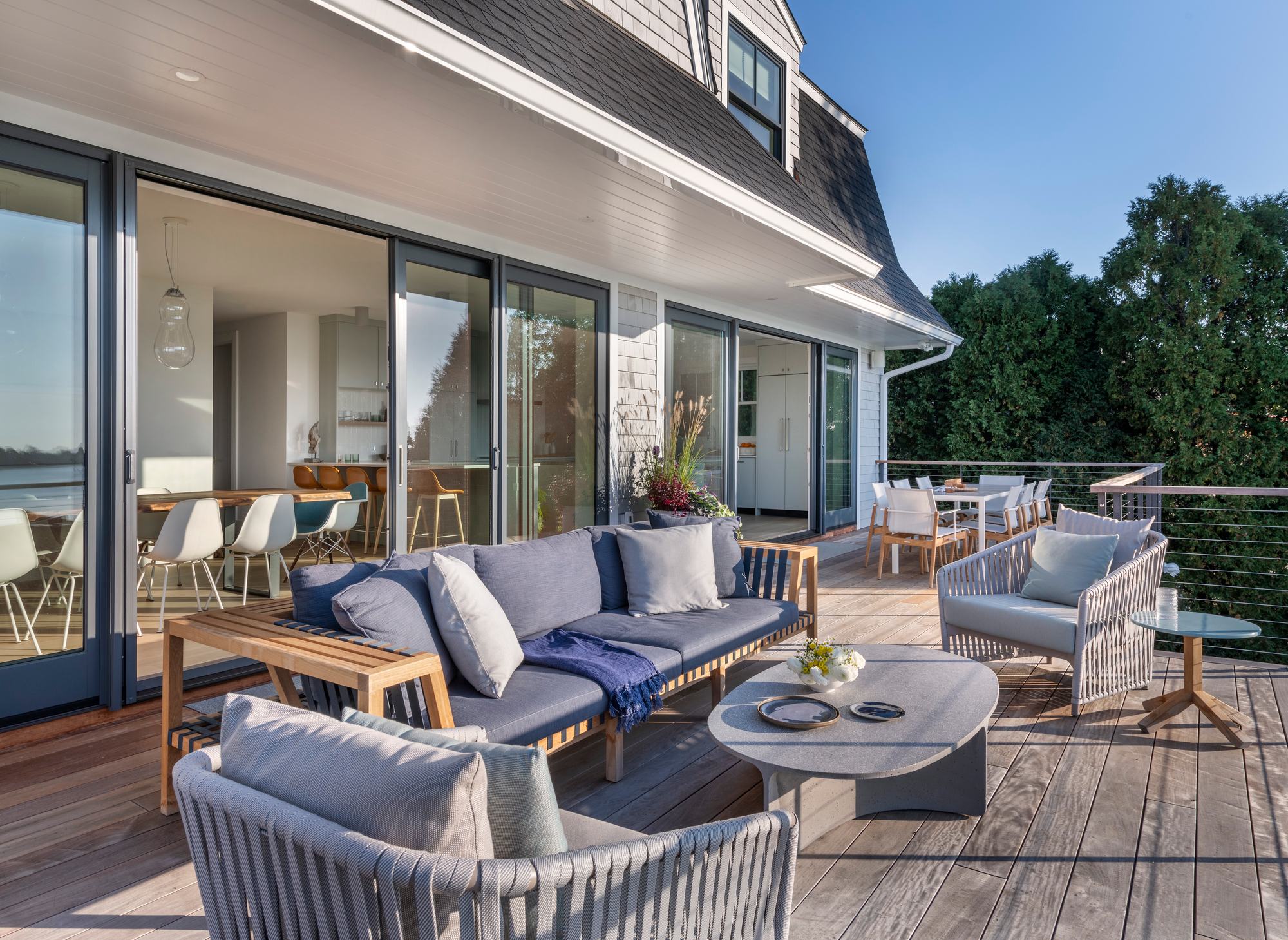 Rhode Island Residence — golden-hour deck and outdoor living over the water