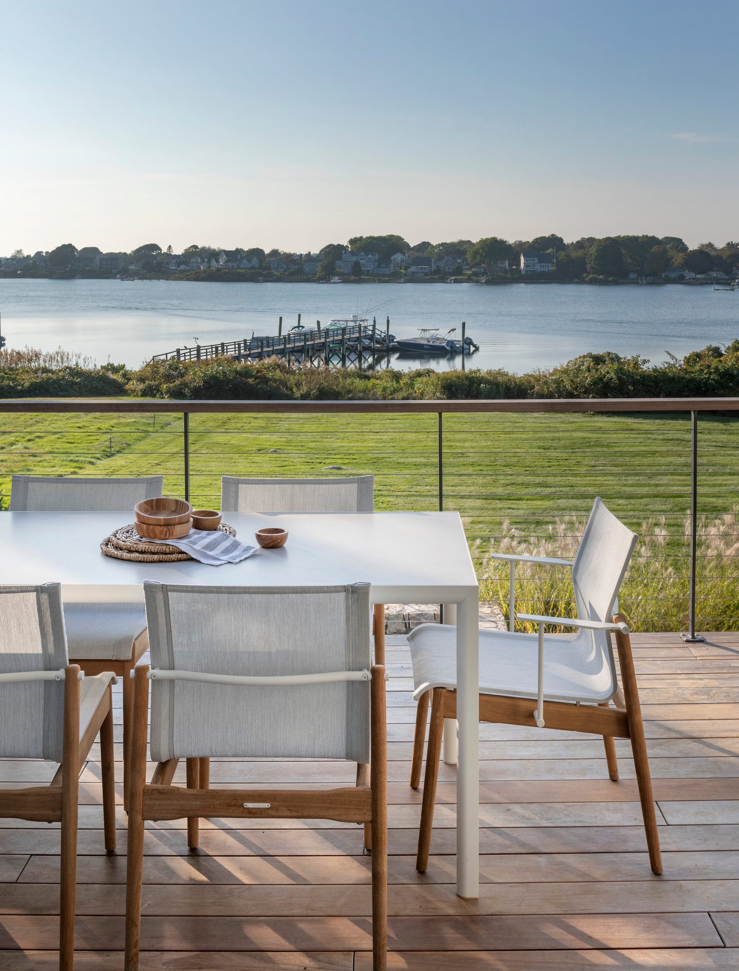 Rhode Island Residence — outdoor dining on the deck above the cove
