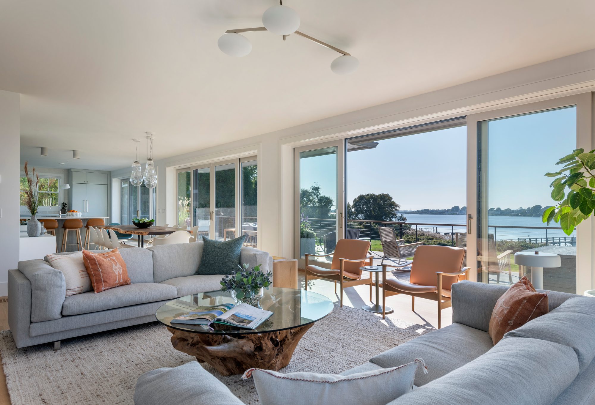 Rhode Island Residence — open great room and kitchen with sliders to the deck and water