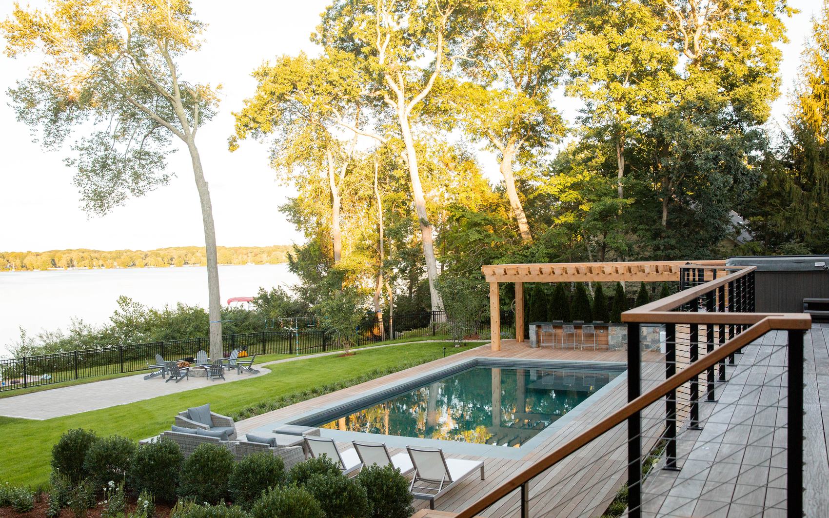 Sharon Landscape — elevated view across the pool, ipe deck, cedar pergola, and lake