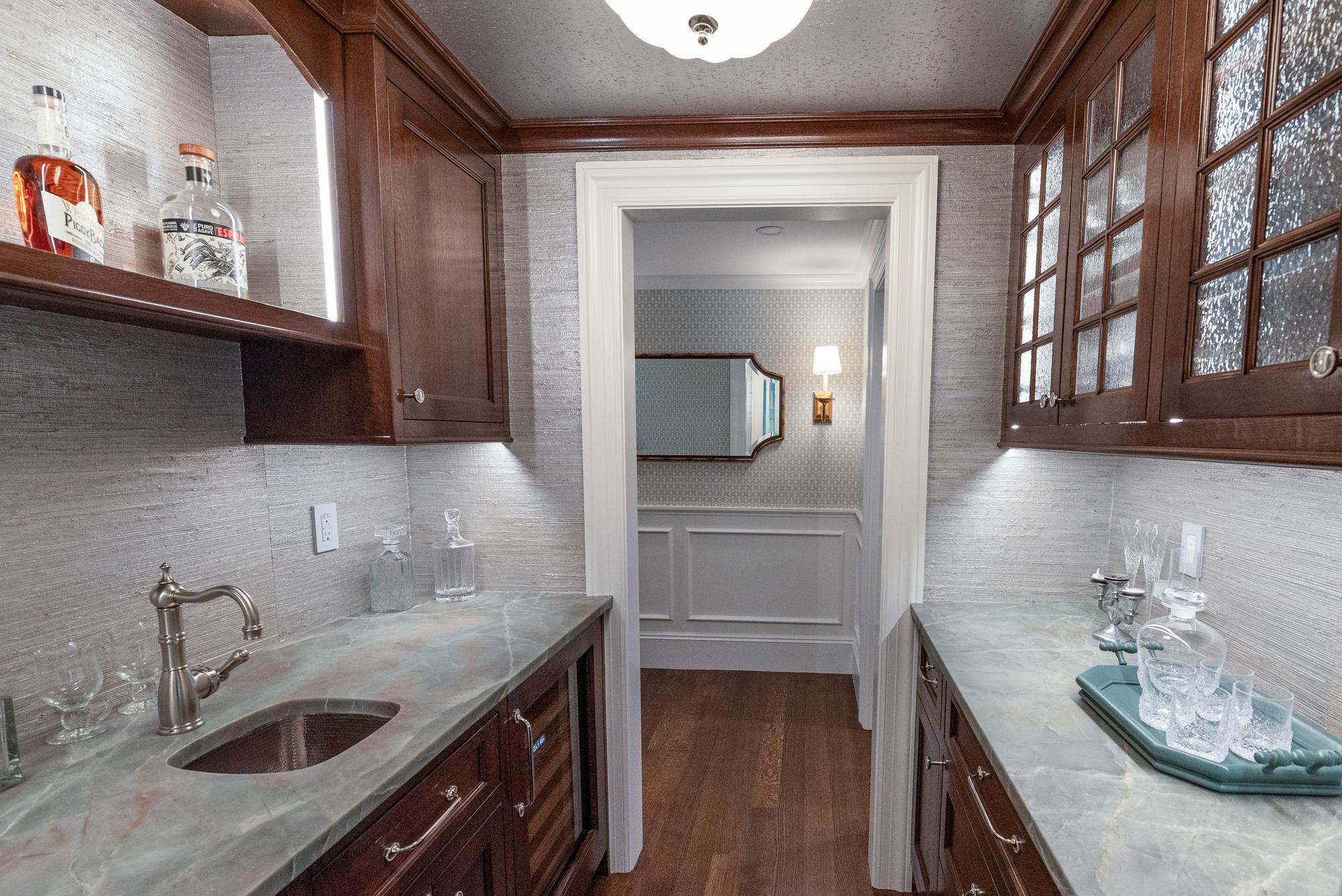 Wellesley Renovation — wet bar with open shelving and stone counters