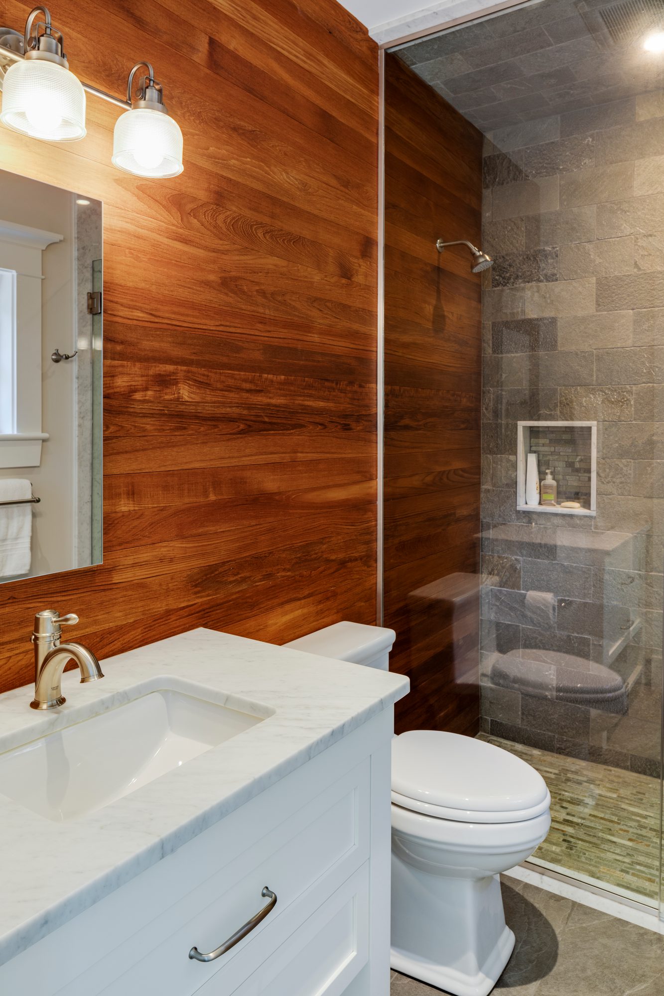 Weston Residence — bathroom with wood-plank wall and glass shower