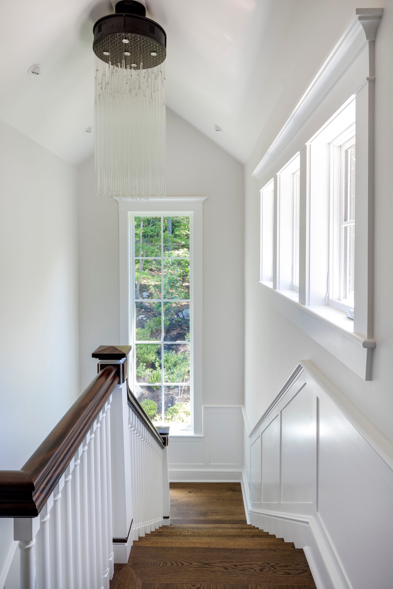 Weston Residence — staircase detail with wood-capped newel posts
