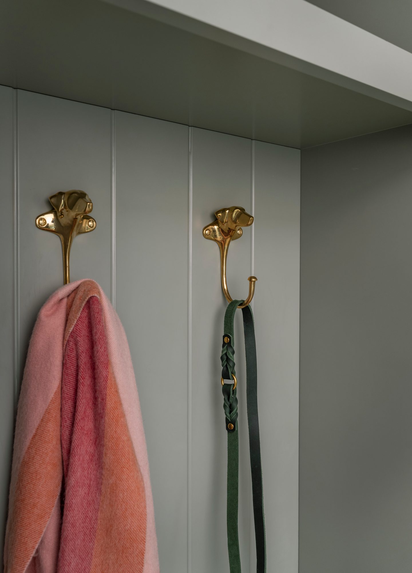 Westport Residence — mudroom detail with brass hooks on board-and-batten panelling