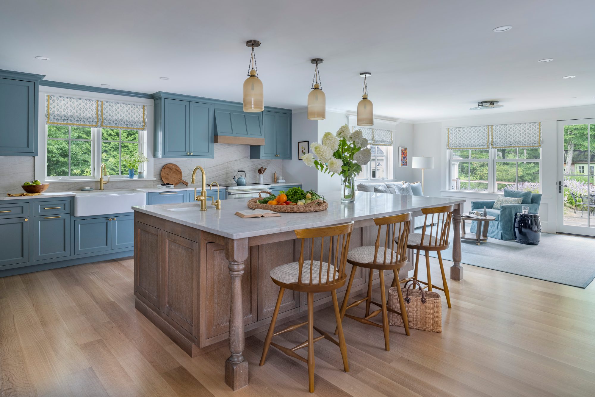 Westport Residence — kitchen with blue cabinetry, a wood island, and an apron-front sink