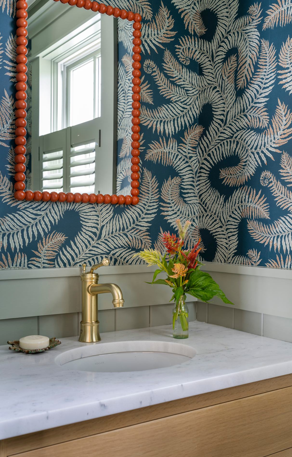 Westport Residence — powder room with patterned wallpaper and a marble vanity