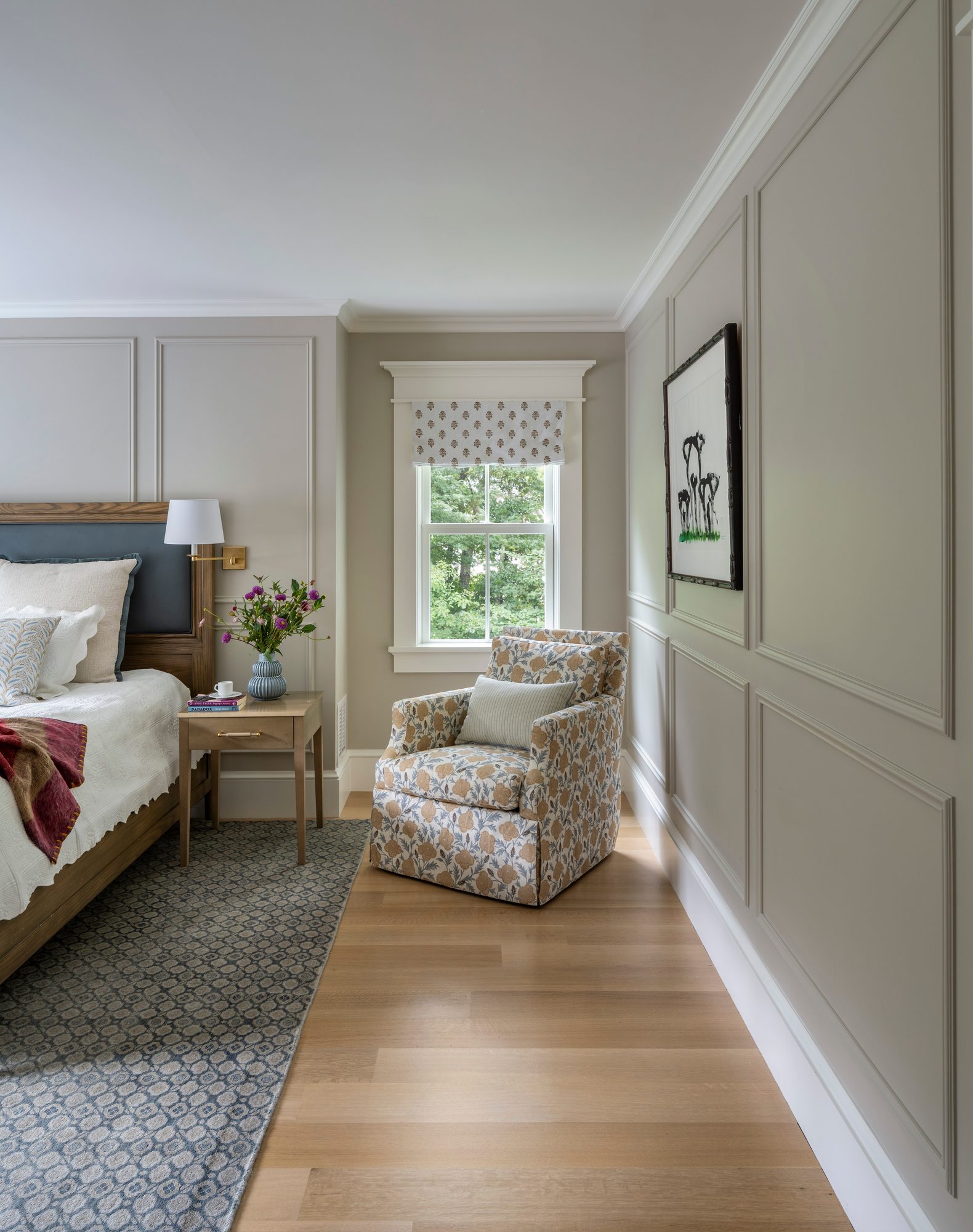 Westport Residence — bedroom with panelled walls and a window seating corner