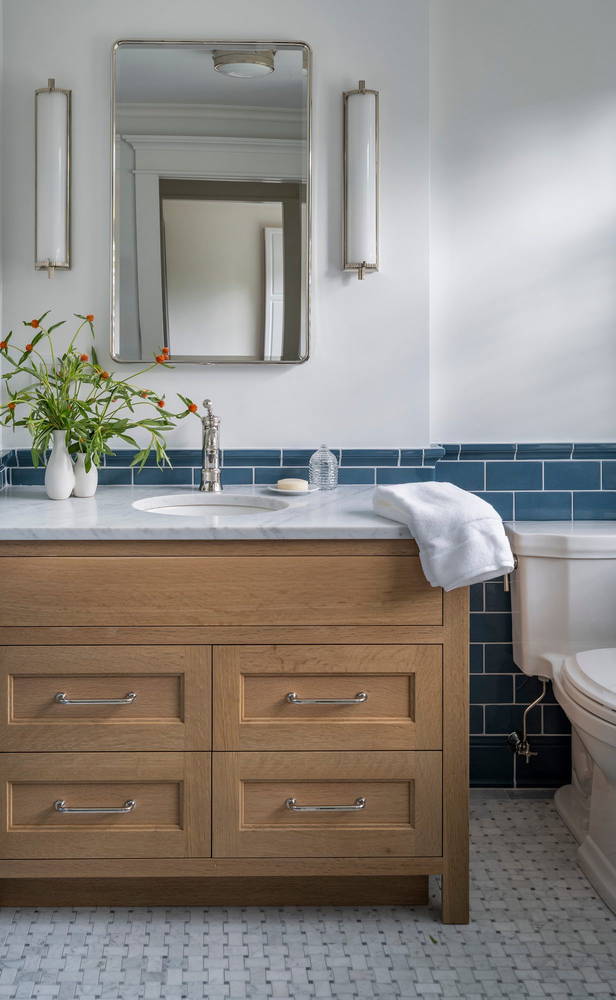Westport Residence — bath vanity with blue tile and a polished nickel mirror