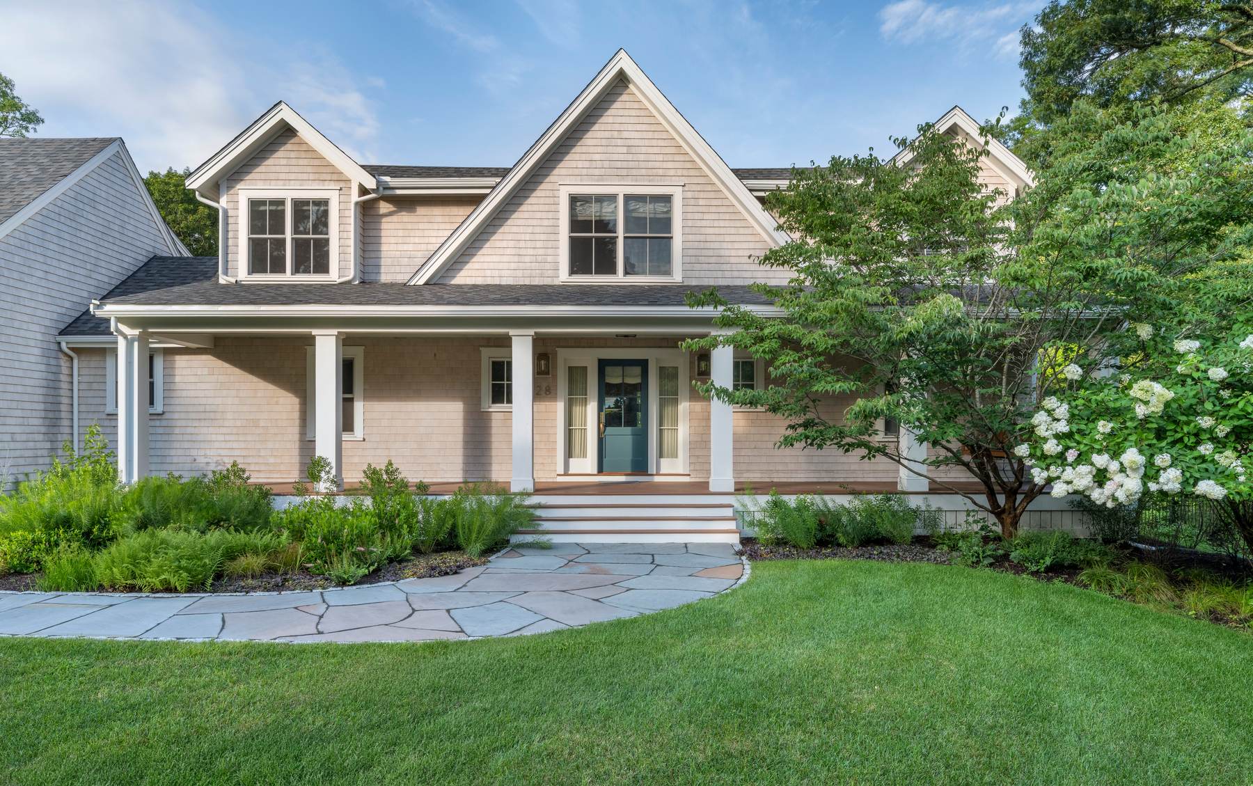 Westport Residence — shingled front elevation with gables, covered porch, and a flagstone walk