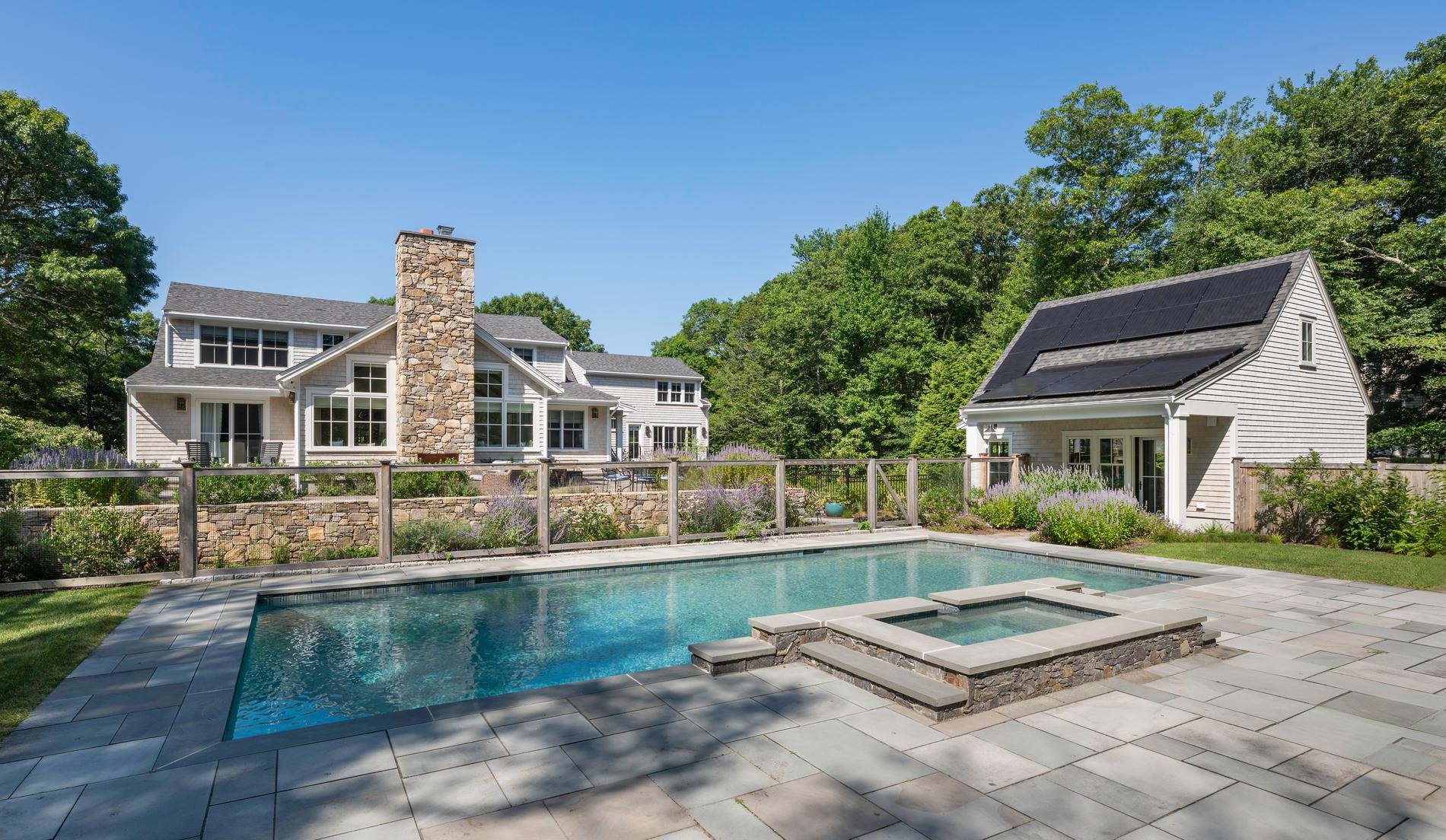 Westport Residence — pool and bluestone terrace with the pool house beyond